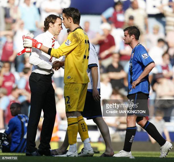 Middlesbrough's Manager Gareth Southgate shakes hands with Middlesbrough's Australian goalkeeper Brad Jones after Middlesbrough are relegated after...