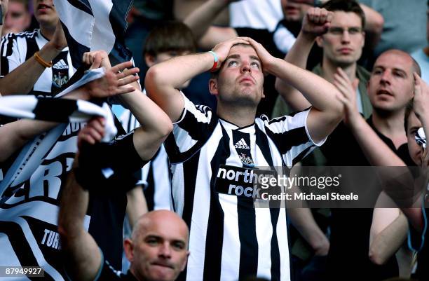 Newcastle United fan reacts after Newcastle United are relegated after their 0-1 defeat to Aston Villa during the Barclays Premier League match...
