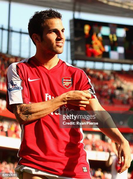 Cesc Fabregas of Arsenal takes off his captains armband after the Barclays Premier League match between Arsenal and Stoke City at Emirates Stadium on...