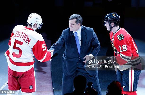 Rocky Wirtz, Team Chairman of Chicago Blackhawks greets Nicklas Lidstrom of the Detroit Red Wings and Jonathan Toews of the Blackhawks prior to...