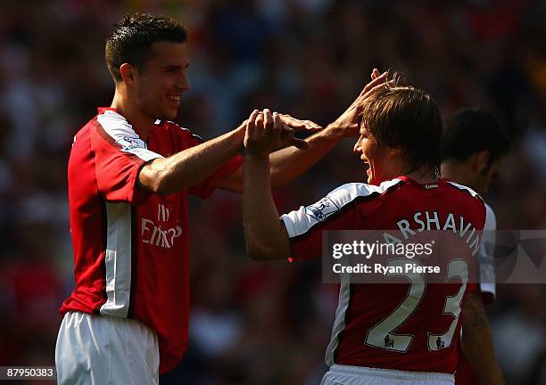 Robin Van Persie of Arsenal celebrates with Andrey Arshavin after scoring his team's second goal during the Barclays Premier League match between...