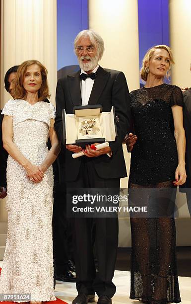 Austrian director Michael Haneke poses next to the president of the jury French actress Isabelle Huppert and US actress Robin Wright Penn after being...