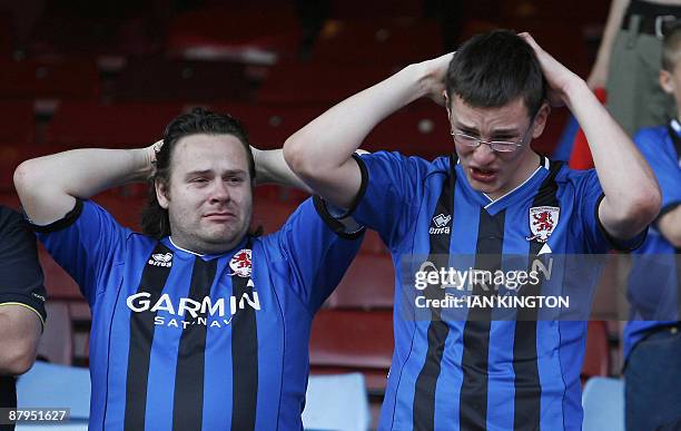 Dejected Middlesbrough fans after Middlesbrough are relegated after being beaten 2-1 by West Ham United in the English Premier League football match...