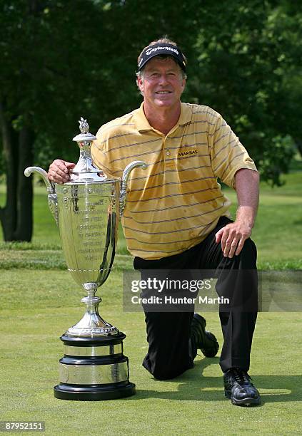 Michael Allen holds the Alfred S. Bourne trophy after winning the 70th Senior PGA Championship at Canterbury Golf Club on May 24, 2009 in Beachwood,...