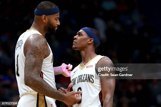 DeMarcus Cousins of the New Orleans Pelicans and Rajon Rondo of the New Orleans Pelicans talk on the court during the first half of a NBA game...