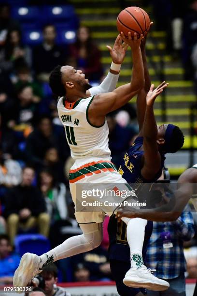 Bruce Brown Jr. #11 of the Miami Hurricanes shoots over Saul Phiri of the La Salle Explorers during the first half at Santander Arena on November 22,...