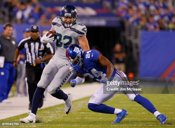 Luke Willson of the Seattle Seahawks in action against Eli Apple of the New York Giants on October 22, 2017 at MetLife Stadium in East Rutherford,...