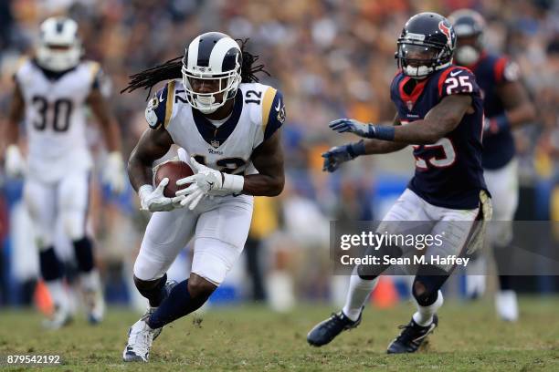 Sammy Watkins of the Los Angeles Rams runs past Kareem Jackson of the Houston Texans during the first half of game at Los Angeles Memorial Coliseum...