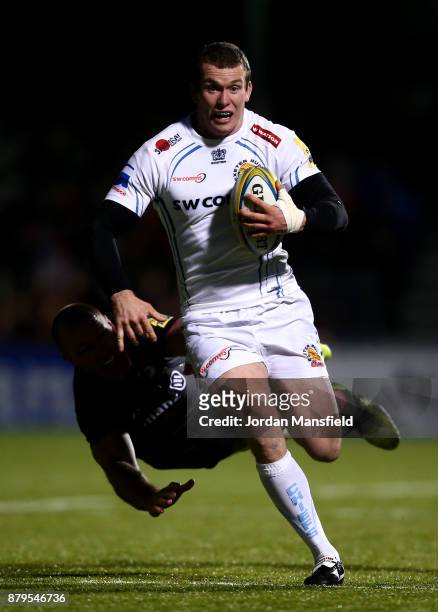 Ian Whitten of Exeter avoids a tackle from Schalk Burger of Exeter during the Aviva Premiership match between Saracens and Exeter Chiefs at Allianz...