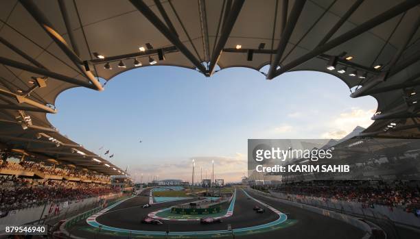 Drivers steer their cars during the Abu Dhabi Formula One Grand Prix at the Yas Marina circuit on November 26, 2017. Valtteri Bottas survived several...
