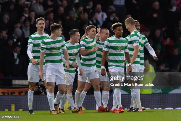 James Forrest of Celtic celebrates scoring the opening goal of the game with his team mates during the Betfred League Cup Final between Celtic and...
