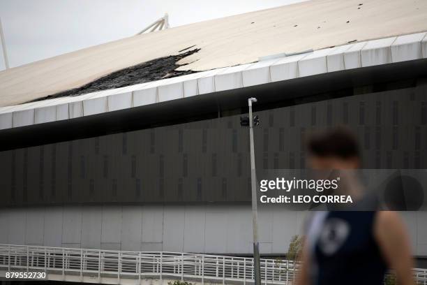 Man walks past Brazil's Olympic velodrome in Rio de Janeiro, Brazil, on November 26, 2017. The already damaged Olympic Velodrome caught fire...