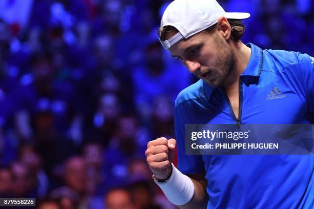 France's Lucas Pouille reacts during his singles rubber 5 match against Belgium's Steve Darcis at the Davis Cup World Group final tennis match...