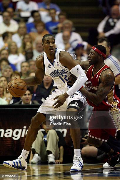 Dwight Howard of the Orlando Magic drives against Ben Wallace of the Cleveland Cavaliers in Game Three of the Eastern Conference Finals during the...