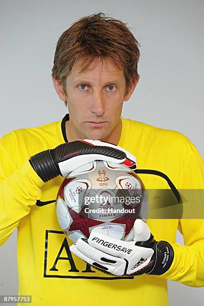 In this handout image provided by adidas, Edwin van der Sar of Manchester United holds the adidas "Finale Rome" official match ball prior to the UEFA...