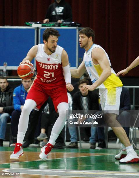Sertac Sanli of Turkey in action against Vyacheslav Kravtsov of Ukraine during the FIBA Basketball World Cup 2019 group B qualifying match between...