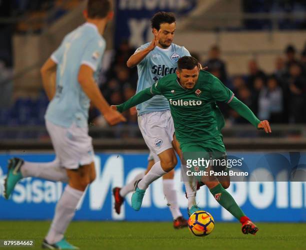 Marco Parolo of SS Lazio competes for the ball with Cyril Therau of ACF Fiorentina during the Serie A match between SS Lazio and ACF Fiorentina at...