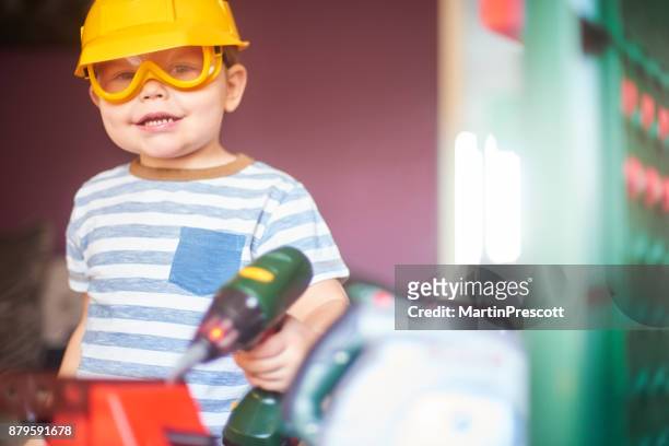 toddler dressing up as a builder - boy in hard hat stock pictures, royalty-free photos & images
