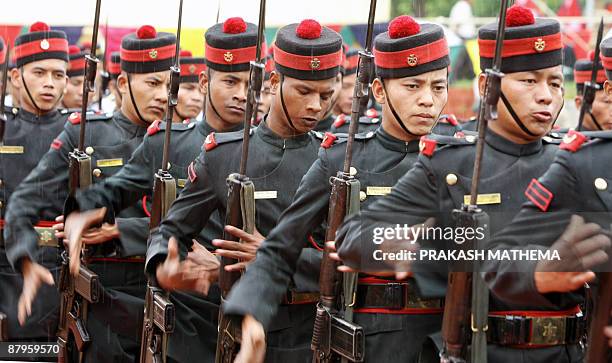 Nepalese Army cadets perform a drill during a swearing in ceremony of Prime minister Madav Kumar Nepal at the office of the President House in Shital...