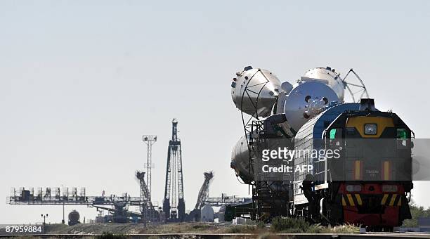 Russian "Soyuz TMA-15" rocket is moved to the launch pad of the Russian leased Baikonur cosmodrome, in Kazakhstan, on May 25, 2009.The "Soyuz TMA-15"...