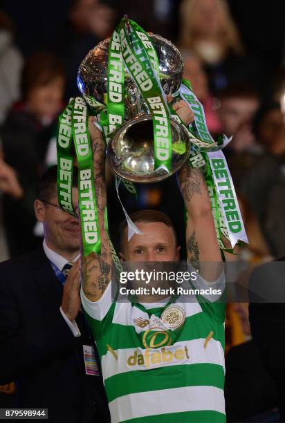 Leigh Griffiths of Celtic lifts the trophy after winning the Betfred League Cup during the Betfred League Cup Final between Celtic and Motherwell at...