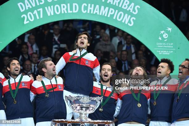 France's Jeremy Chardy, Julien Benneteau, Pierre-Hugues Herbert, Richard Gasquet, Lucas Pouille, Jo-Wilfried Tsonga and Yannick Noah pose with the...