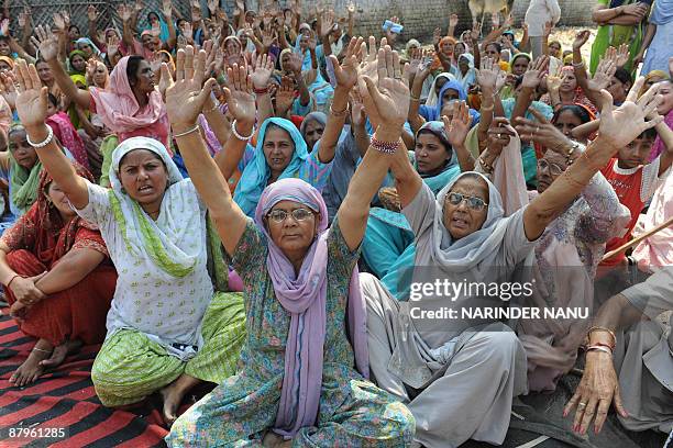 Followers of Guru Ravi Dass protest against the death of their priest Sant Rama Nand, who was killed by fellow Sikhs in a temple in the Austrian...