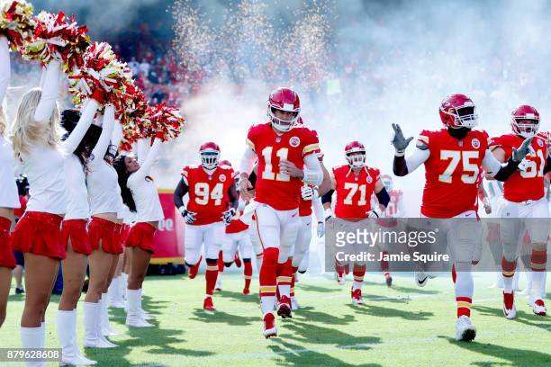 Quarterback Alex Smith of the Kansas City Chiefs takes the field with teammates prior to the game against the Buffalo Bills at Arrowhead Stadium on...