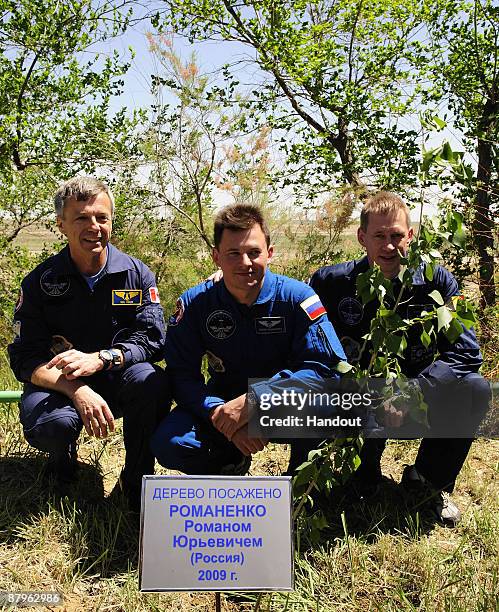 In this undated handout photo provided by the European Space Agency , The Soyuz TMA-15 crew, Robert Thirsk, Roman Romanenko and Frank De Winne take...