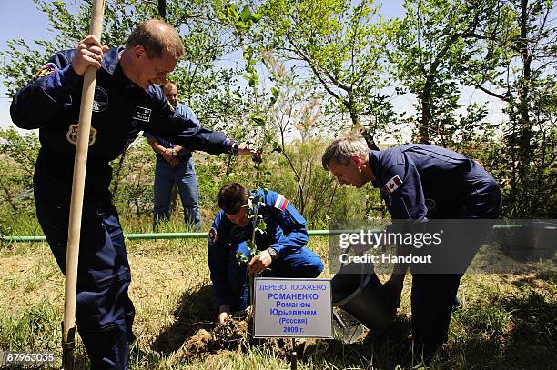 In this undated handout photo provided by the European Space Agency , The Soyuz TMA-15 crew, Frank De Winne, Roman Romanenko and Robert Thirsk take...