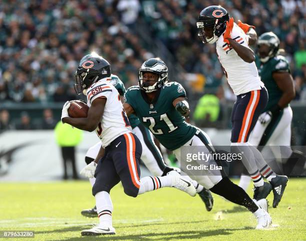 Tarik Cohen of the Chicago Bears carries the ball as Patrick Robinson of the Philadelphia Eagles defends on November 26, 2017 at Lincoln Financial...