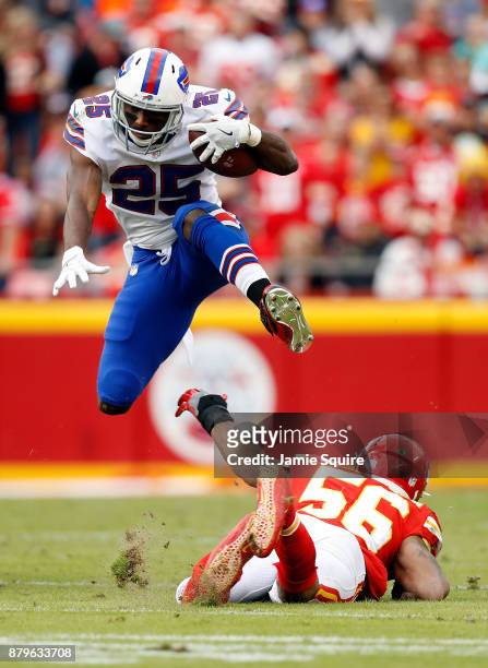 Running back LeSean McCoy of the Buffalo Bills leaps over inside linebacker Derrick Johnson of the Kansas City Chiefs during the game at Arrowhead...