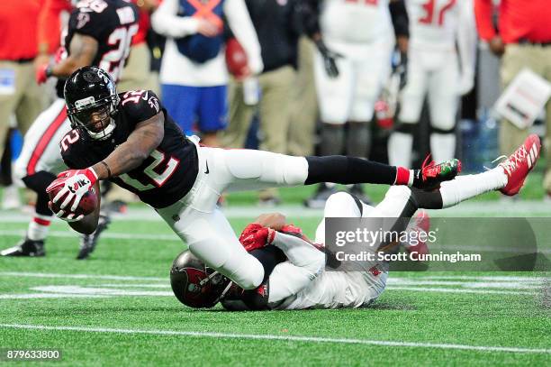 Mohamed Sanu of the Atlanta Falcons is tackled after a catch during the first half against the Tampa Bay Buccaneers at Mercedes-Benz Stadium on...