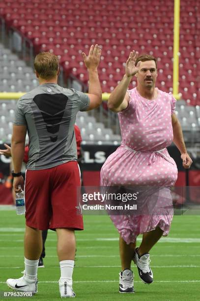 Drew Stanton of the Arizona Cardinals takes the field wearing a costume prior to the NFL game against the Jacksonville Jaguars at University of...