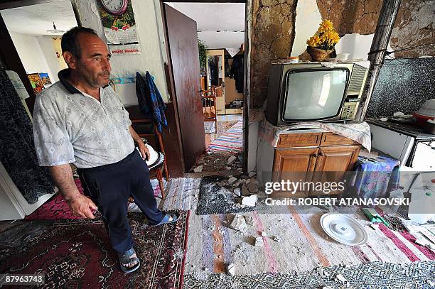 Villager looks at the damage to his house after an earthquake hit the village of Basi Boz, near the town of Valandovo, some 160 km east of Skopje on...