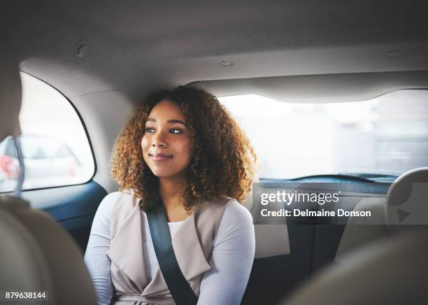 patiently waiting to get to her destination - car passenger stock pictures, royalty-free photos & images