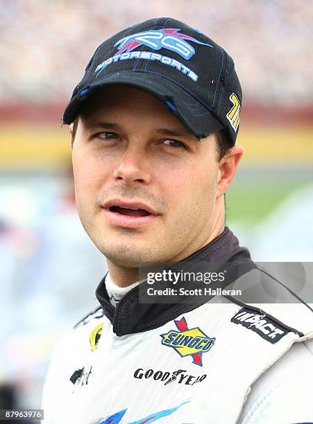 David Gilliland, driver of the TRG Motorsports Chevrolet, stands on the grid prior to the start of the NASCAR Sprint Cup Series Coca-Cola 600 on May...