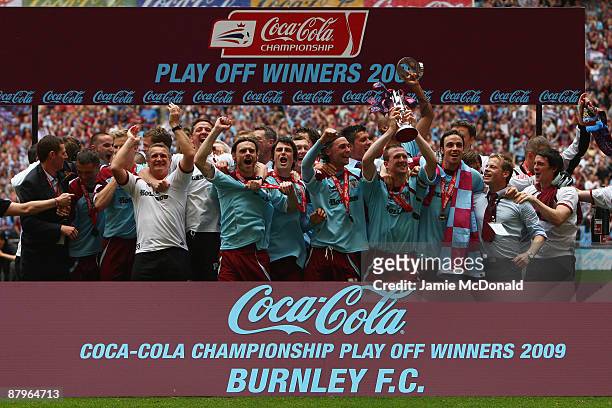Burnley players celebrate victory with the trophy during the Coca-Cola Championship Playoff Final between Burnley and Sheffield United at Wembley...