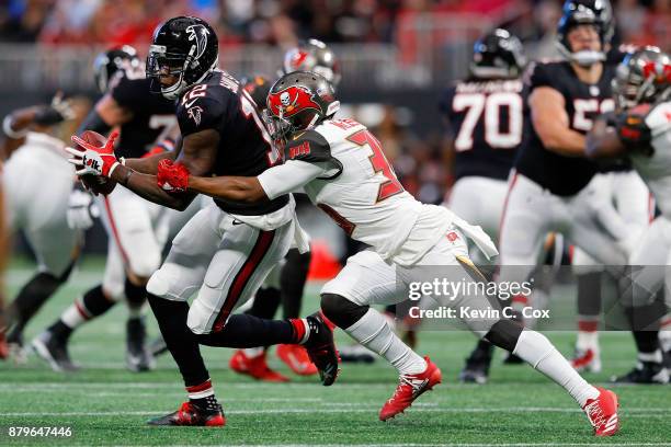 Mohamed Sanu of the Atlanta Falcons is tackled by Robert McClain of the Tampa Bay Buccaneers after a catch during the first half against the Tampa...