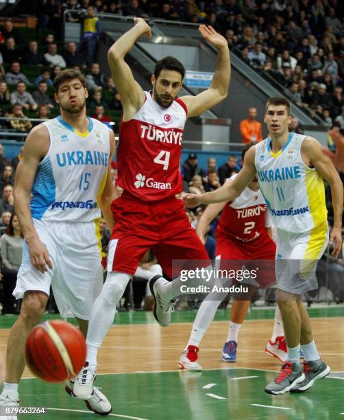 Dogus Balbay of Turkey in action against Vyacheslav Kravtsov and Oleksandr Lypovyy of Ukraine during the FIBA Basketball World Cup 2019 group B...