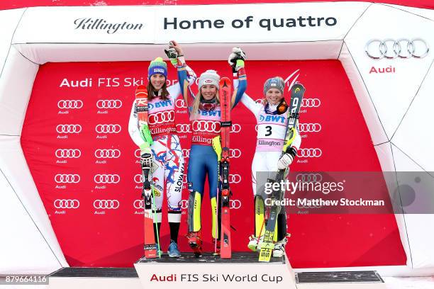 Petra Vlhova of Slovakia, Mikaela Shiffrin of the United States and Bernadette Schild of Austria celebrate on the medals podium after the Slalom...