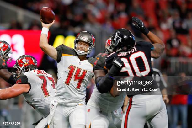 Ryan Fitzpatrick of the Tampa Bay Buccaneers throws a pass during the second half against the Atlanta Falcons at Mercedes-Benz Stadium on November...