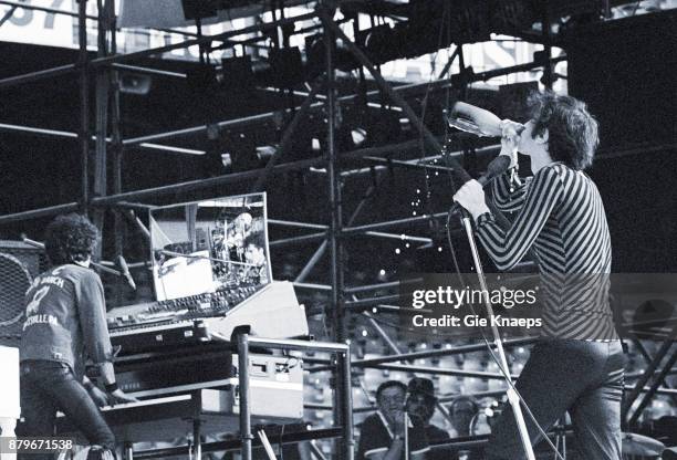 Opening for The Rolling Stones, Peter Wolf with a bottle of champagne, Seth Justman, The J Geils Band, performing on stage, Feyenoord Stadion ,...