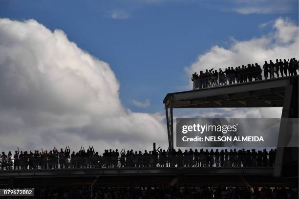 Corinthians' supporters cheer their team during their Brazilian Championship football match against Atletico Mineiro at the Arena Corinthians stadium...