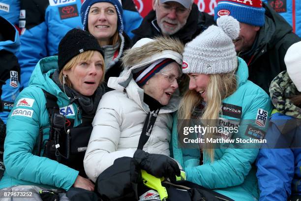 Mikaela Shiffrin of the United States sits with her mother Eileen Shiffrin and grandmother Pauline Condron on the medals podium for a family photo...