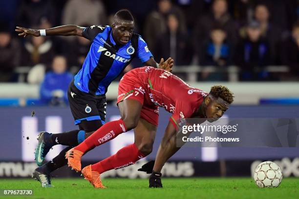 Aaron Leya Iseka forward of SV Zulte Waregem is challenged by Marvelous Nakamba midfielder of Club Brugge during the Jupiler Pro League match between...