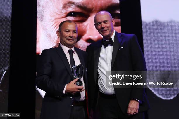 Eddie Jones of England receives the World Rugby via Getty Images Coach of the Year Award from Sir Clive Woodward during the World Rugby via Getty...