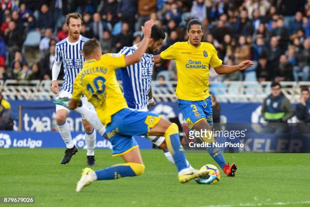 Xabi Prieto of Real Sociedad duels for the ball with Javi Castellano and Lemos of U D Las Palmas during the Spanish league football match between...