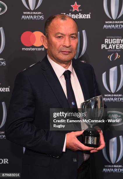 Eddie Jones of England poses with the World Rugby via Getty Images Coach of the Year Award during the World Rugby via Getty Images Awards 2017 in the...