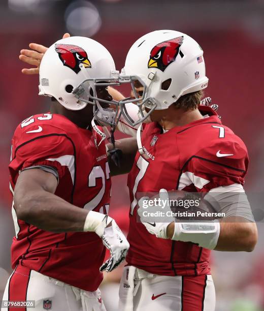 Running back Adrian Peterson and quarterback Blaine Gabbert of the Arizona Cardinals talk during warm ups to the NFL game at the University of...